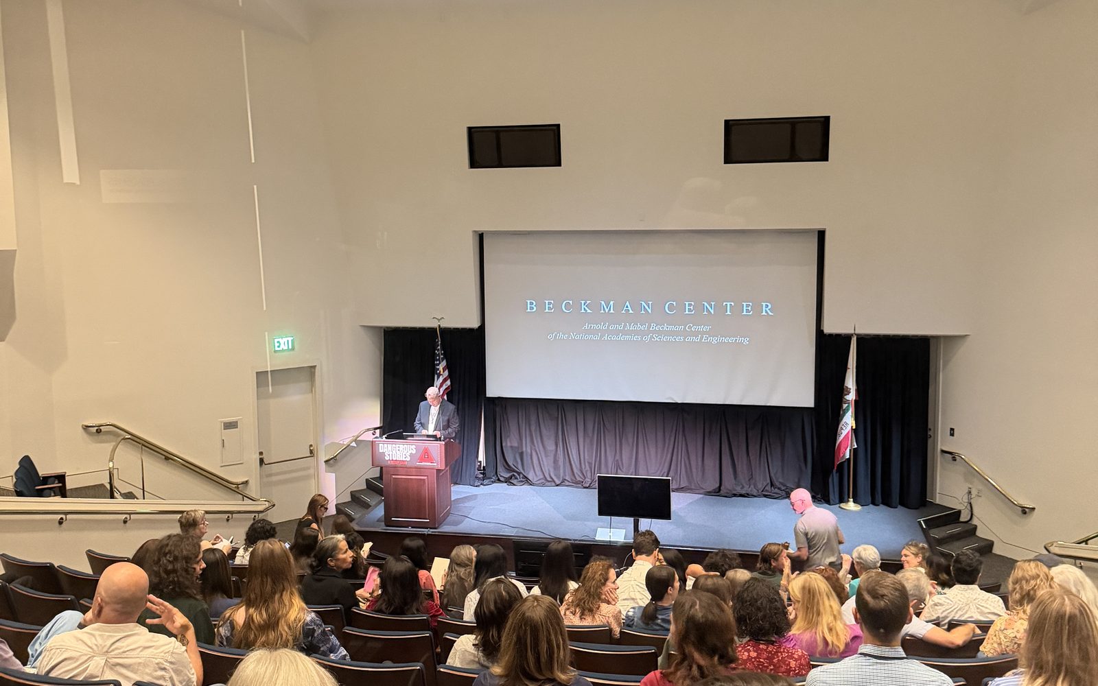 A full Beckman Center Auditorium on the opening morning of Dangerous Stories, seen from the balcony