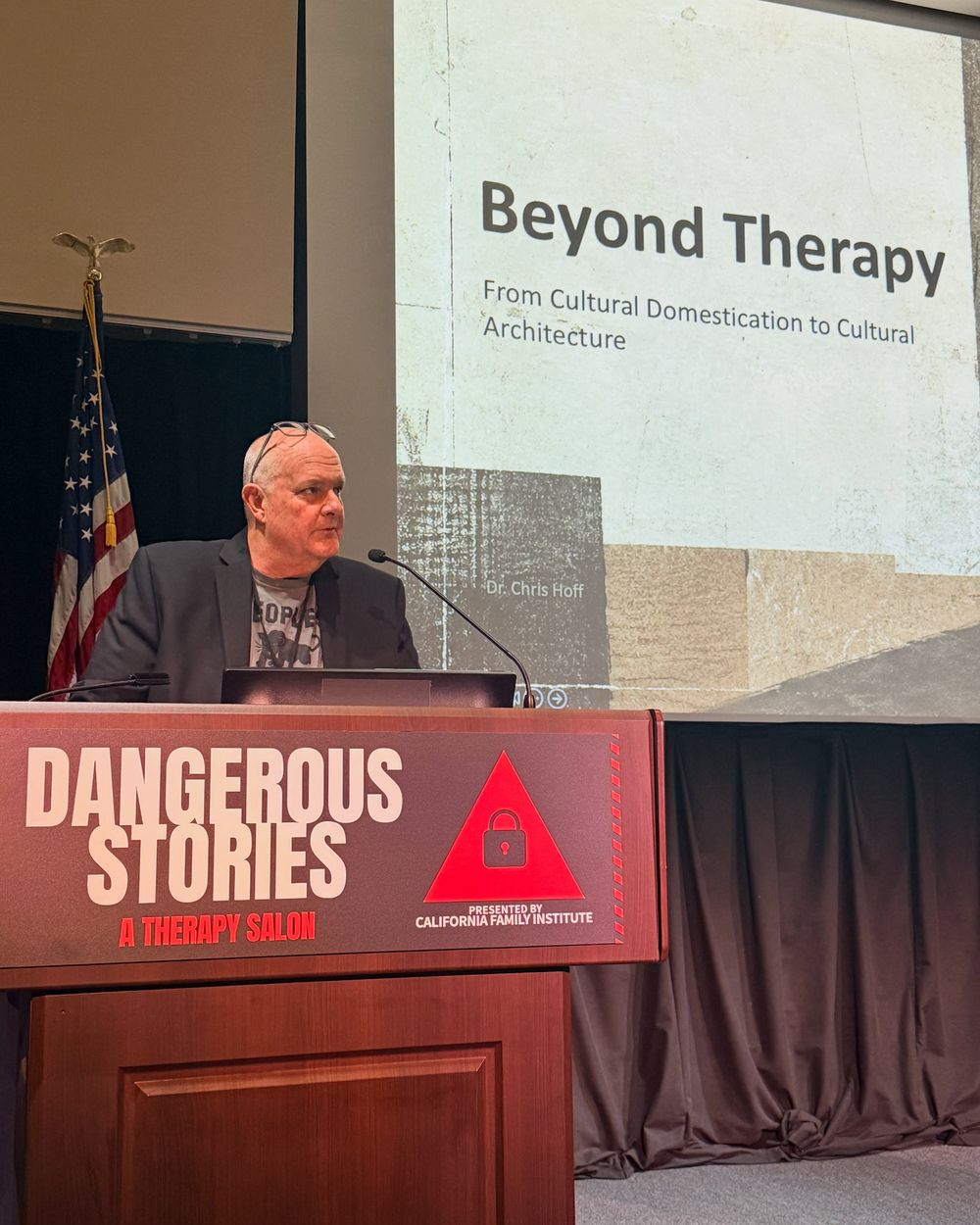 Chris Hoff at the lectern in front of a slide reading Beyond Therapy